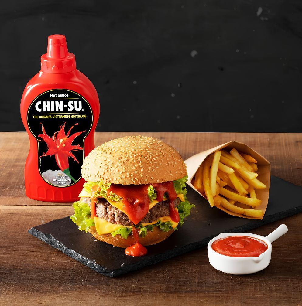 chin-su hot sauce original with burger