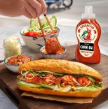chin-su sriracha hot sauce with banh mi